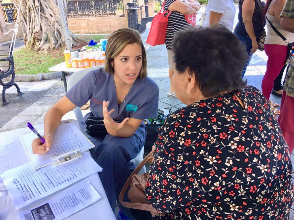 UMHS student with patient in Puerto Rico